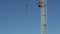 Large crane hook with slings on wind against the sky