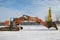 large crawler excavators are standing at a construction site