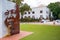 Large creative Nelson Mandela stone artwork standing in the center of green courtyard in Stellenbosch.