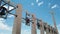 Large cross and bells over a bright blue sky background in Puglia - South Italy