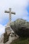 A large cross of the observation platform Cruz Alta and a huge boulder next to it.