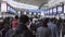 Large crowd group of Asian people walk at Shinagawa subway train station hallway. Japan city life,