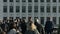 Large crowd of pedestrians walk over London Bridge 16