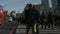 Large crowd of pedestrians walk over London Bridge 41a