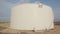 Large crude oil storage tanks in a huge refinery