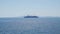 Large cruise ship with five masts silhouette on the horizon.