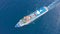 Large cruise ship sailing across sea, aerial top view