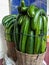 Large cucumbers arranged in baskets or containers