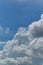 A large Cumulus cloud against a clear blue sky