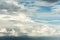 Large Cumulus cloud before the rain in the evening at sunset. The cloud is illuminated by the evening sunlight