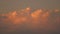 Large cumulus clouds swirl rapidly in the sky. beautiful sky above the ocean with pink clouds. Epic stormy tropical