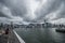 Large dark clouds gather above Hong Kong island, seen from Kowloon at Victoria Bay