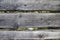 Large, dark, old wooden planks with green grass. Menu for the organic restaurant. Background for leaflets, wine lists, menus, busi
