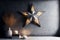 Large decorative retro star with lots of burning lights on grunge concrete background. Beautiful decor, modern design element. The