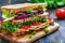 Large delicious club sandwich with roast chicken, greens and vegetables on wooden table