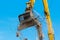Large demolition crane claw dismantling a building
