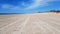 Large deserted sandy beach during Covid 19 on the shores of the Baltic Sea on a bright sunny day