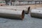 Large diameter pipes lying on the gravel on the spot welding