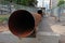 Large diameter rusty pipes fenced