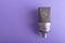 Large diaphragm condenser studio microphone Neumann tlm 103 on purple background.