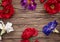 Large different flowers top view on Valentine`s day isolated on wooden background. Flat lay Copy space