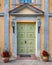 Large door of an old house with lanterns