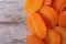 Large dried apricots close-up on an old wooden table.