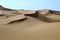 Large dunes in the Sahara deformed by the wind, Morocco