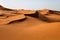 Large dunes in the Sahara deformed by the wind, Morocco