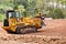 Large earth mover digger clearing land