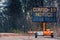 Large electronic notification sign on rural street announcing road closure due to Coronavirus Covid-19 pandemic