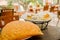 Large empanada on wooden table next to basket of