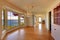 Large empty old living room interior with fireplace.