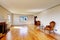 Large empty old living room interior with fireplace.