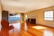 Large empty old living room interior with fireplace.