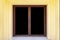 Large entrance door brown solid wood building and Yellow cement wall