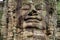 Large ethereal faces carved in stone towers at the Bayon Temple, Angkor Wat, Cambodia