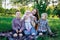 Large family. Mother and three children in the Park. Family outdoor recreation