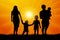 Large family at sunset silhouette vector