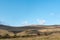 Large farmland hills green blue sky cloudy autumn agriculture farm land landscape clean sharp rural scene