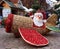 Large figure of Santa Claus standing in the street