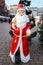 Large figure of Santa Claus standing in the street