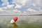 Large float floats on the calm surface of the lake awaiting bite