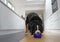 Large fluffy Bernese Mountain Dog eating out of blue bowl.