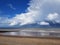 Large fluffy clouds over the Hornsea beach East Yorkshire England uk