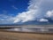 Large fluffy clouds over the Hornsea beach East Yorkshire England uk