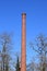 A large, freestanding, disused industrial Fireplace