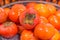 Large fresh persimmons, kaki in Japanese, on sale at winter Farmers Market, Japan.