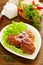 Large fried cutlets with lettuce.