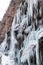 Large frozen icicles on site of waterfalls in mountainous area